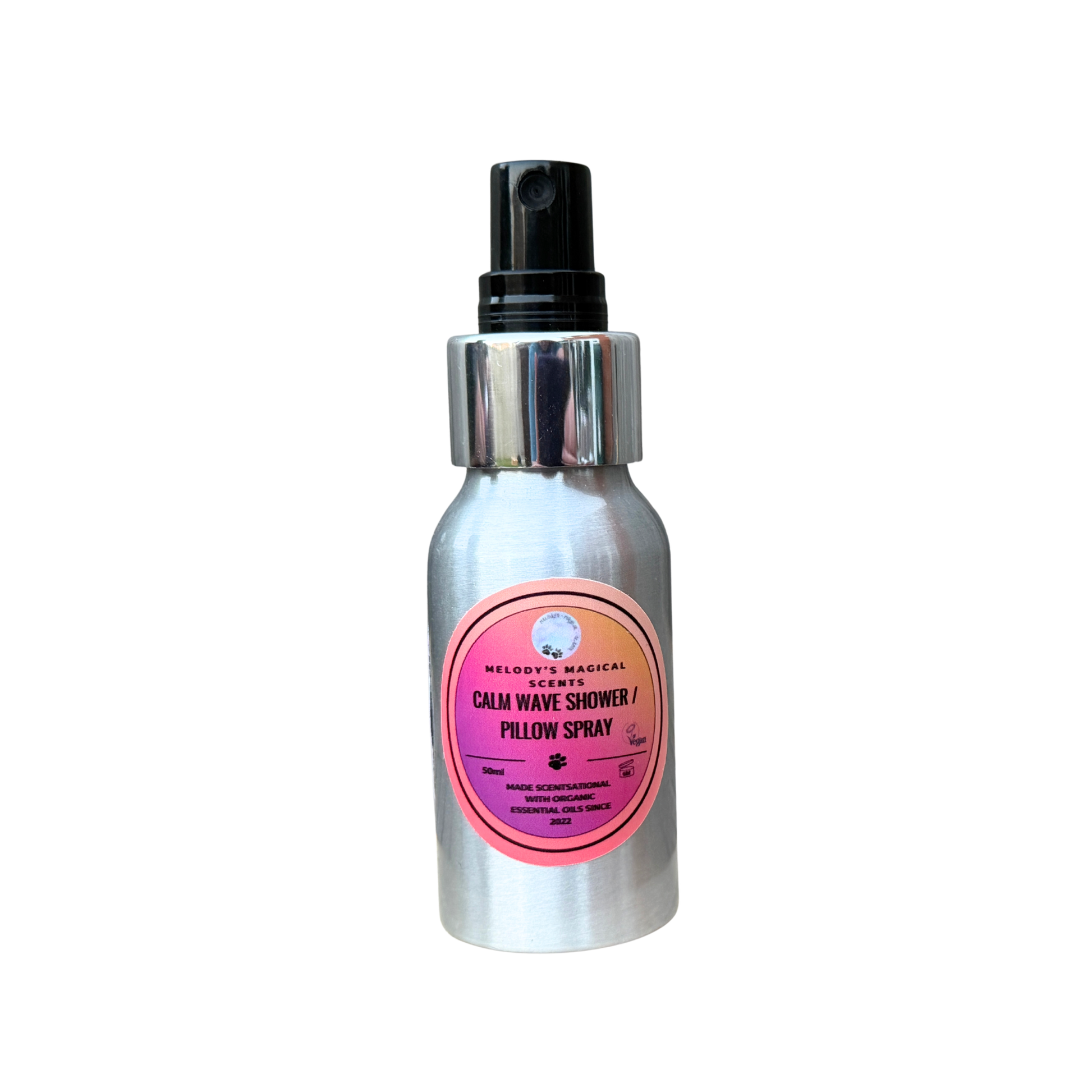 Silver spray bottle with pink label on a white background