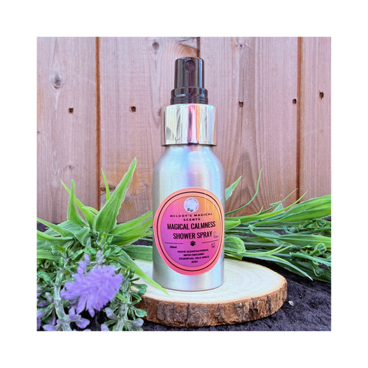 Shower spray bottle with pink label on a wooden surface with plants