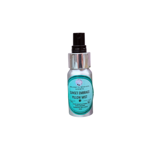 A silver spray bottle of Pillow Mist by Wildth's Magical Scents, featuring a black spray nozzle and a teal and white label, set against a plain white background.